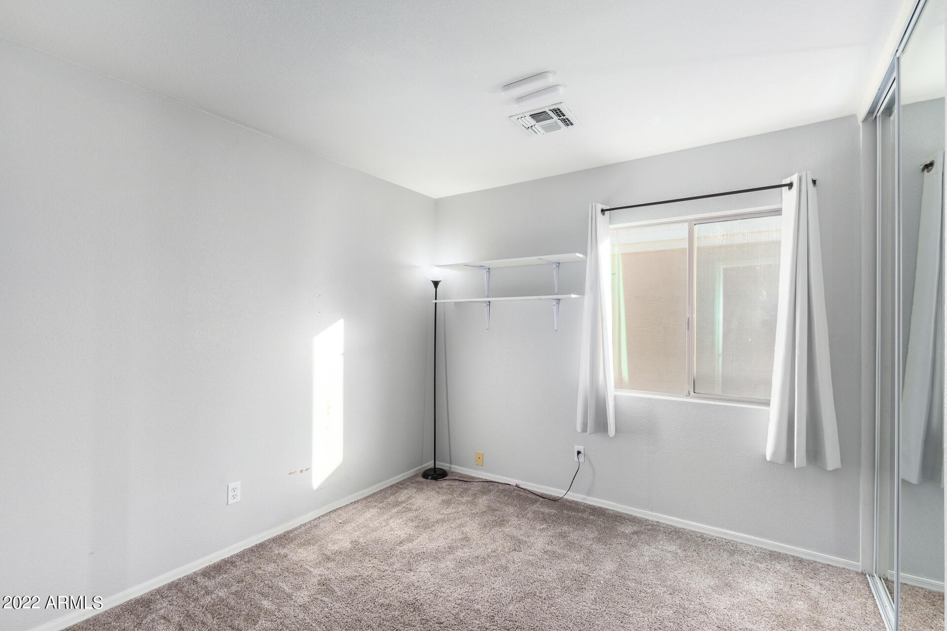 2609 South Devonna Lane Tolleson, AZ 85353 - Photo 23 of 30 a view of an empty room