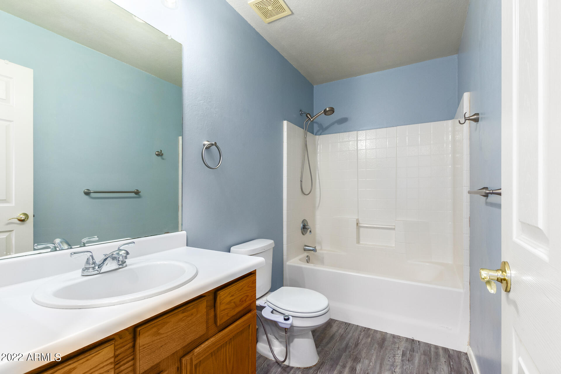 2609 South Devonna Lane Tolleson, AZ 85353 - Photo 24 of 30 a bathroom with a sink toilet and shower