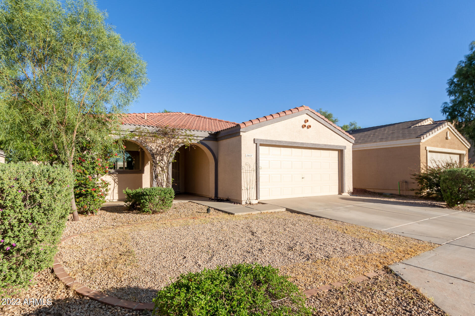 2609 South Devonna Lane Tolleson, AZ 85353 - Photo 4 of 30 a front view of a house with a yard