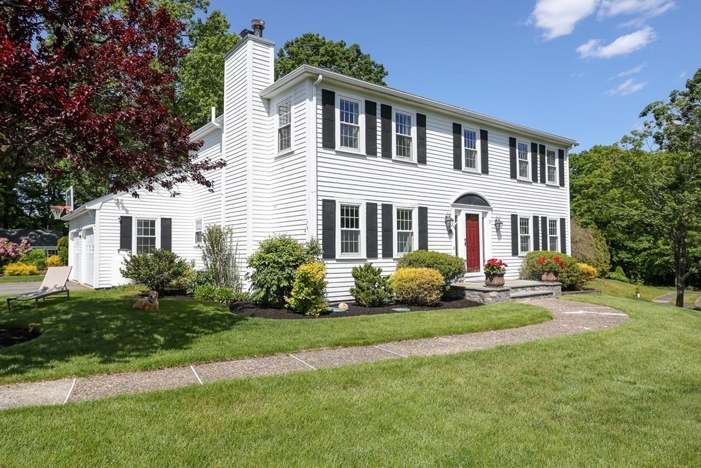 5 Bayberry Road Natick, MA 01760 - Photo 3 of 41 a front view of a house with a garden and porch