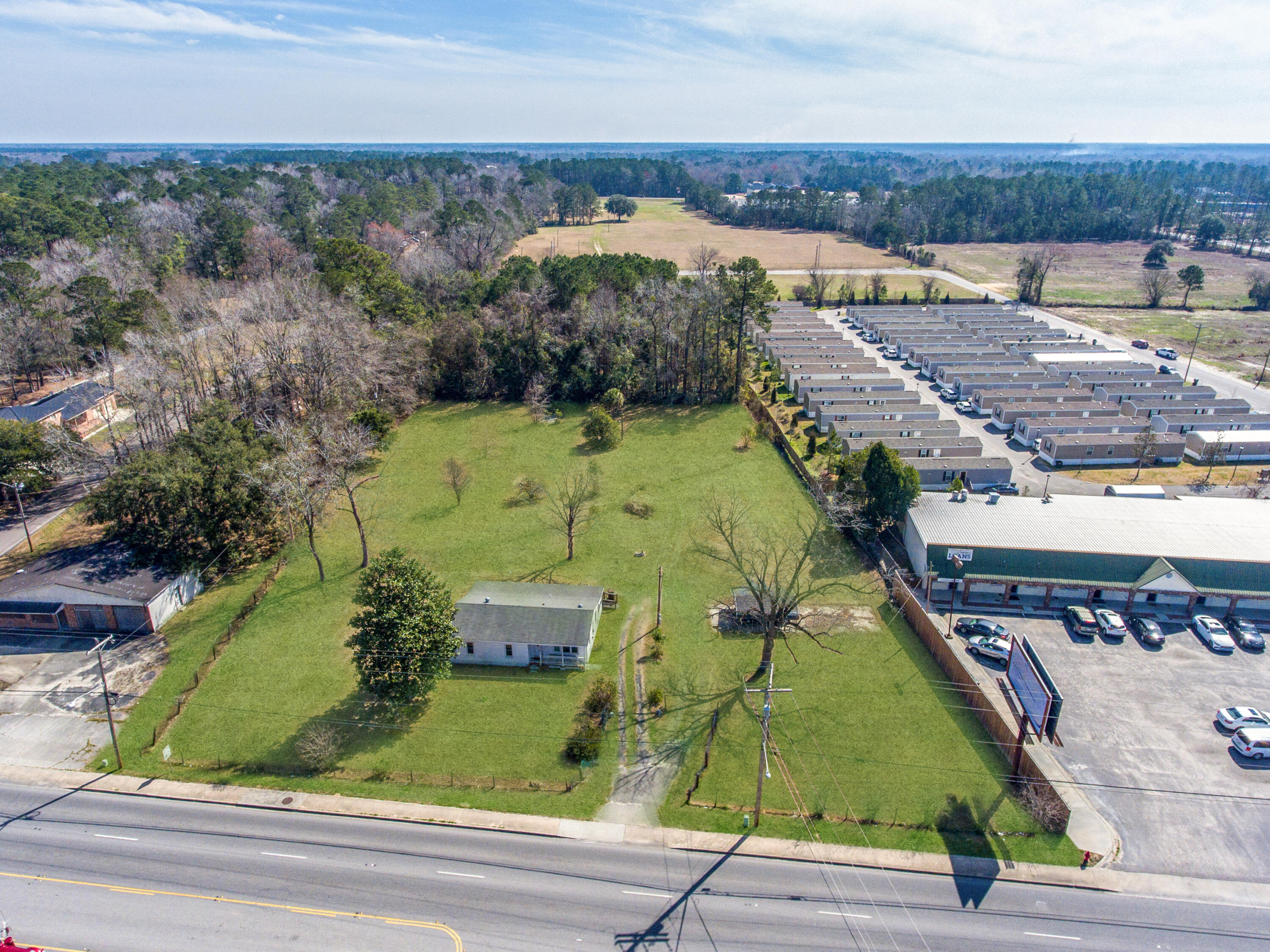 126 North N Highway Moncks Corner, SC 29461 - Photo 3 of 45 126 N Hwy 52 Grass Retouch_Brett Martin