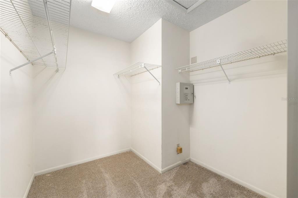 11606 Northwest 120th Terrace Alachua, FL 32615 - Photo 12 of 46 a view of a room with racks on the wall