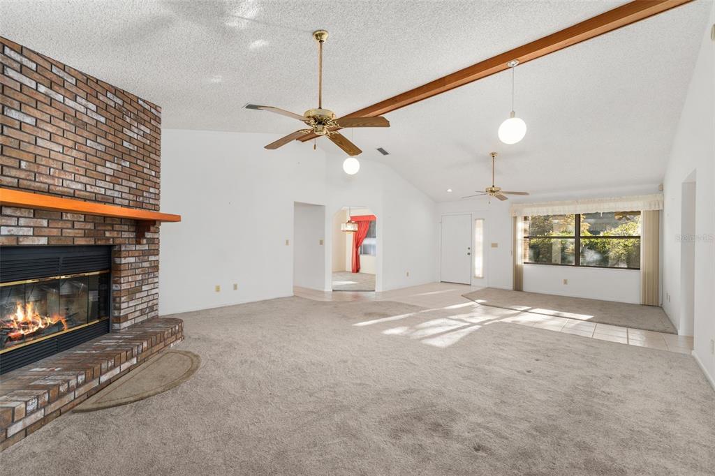 11606 Northwest 120th Terrace Alachua, FL 32615 - Photo 21 of 46 a view of an empty room with a fireplace and window