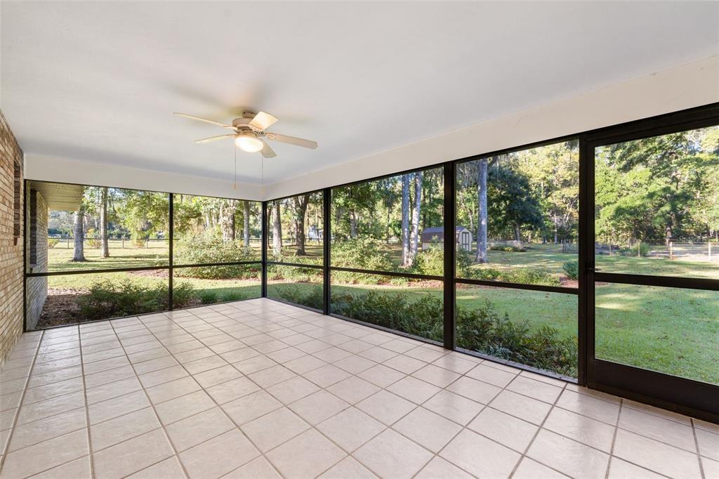 11606 Northwest 120th Terrace Alachua, FL 32615 - Photo 31 of 46 a view of porch with a floor to ceiling window and a larger window
