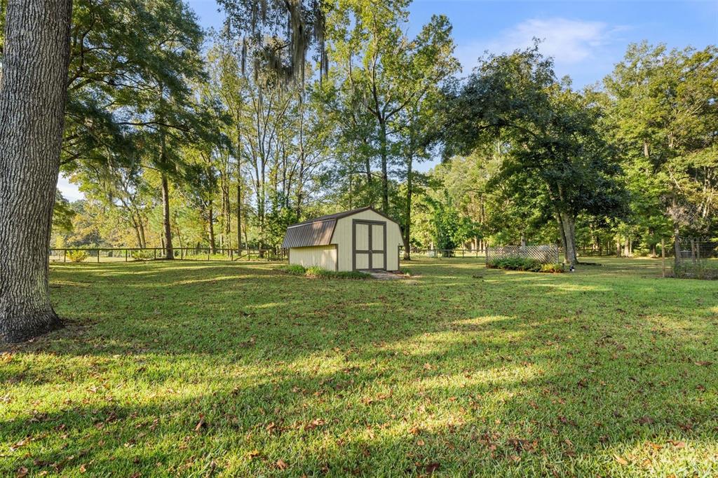 11606 Northwest 120th Terrace Alachua, FL 32615 - Photo 35 of 46 a view of a park with large trees