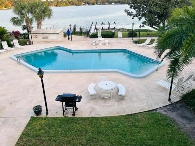 a view of a swimming pool with a patio