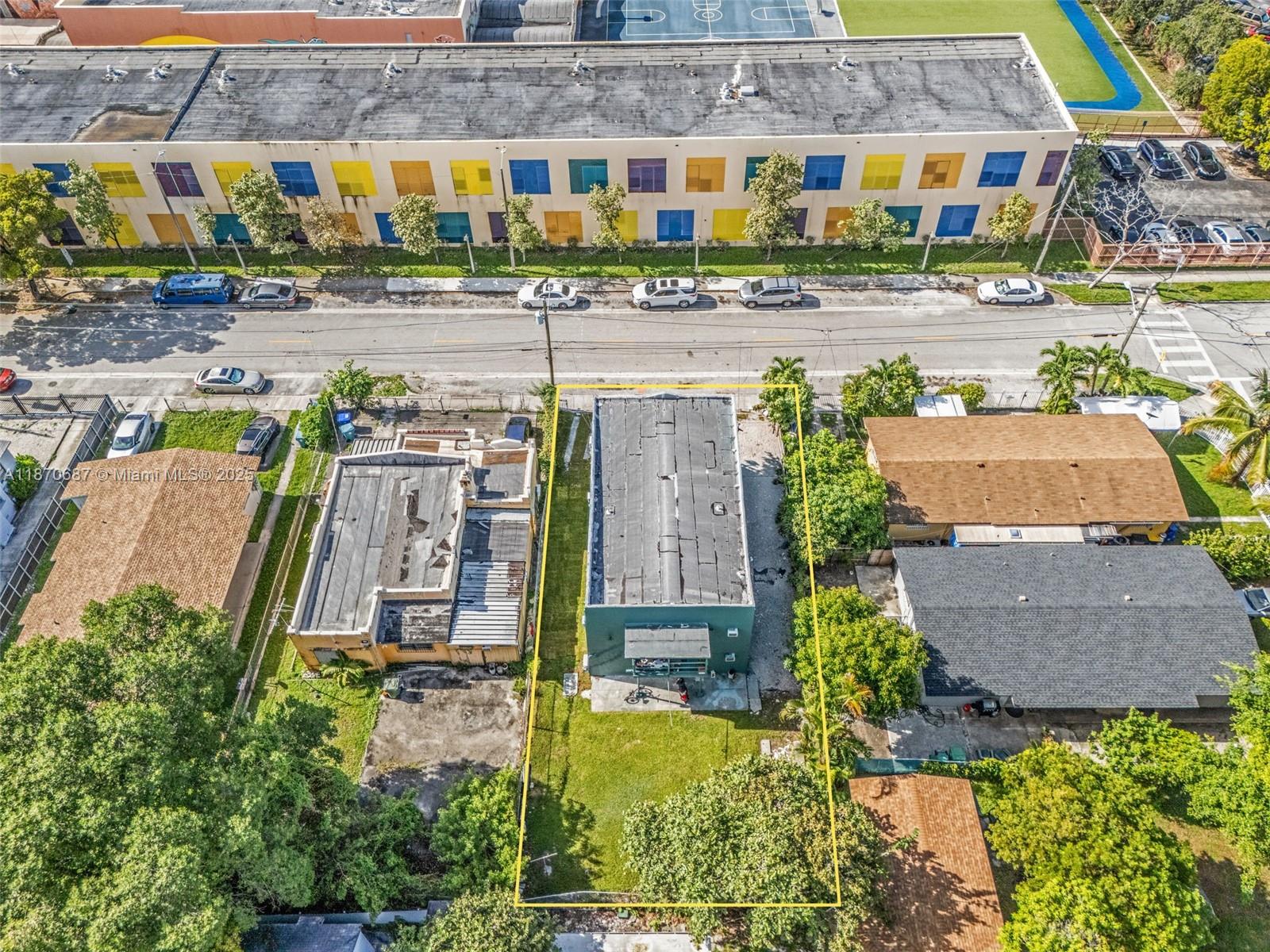 1075 Northwest 30th Street Miami, FL 33127 - Photo 12 of 12 an aerial view of a house with a swimming pool