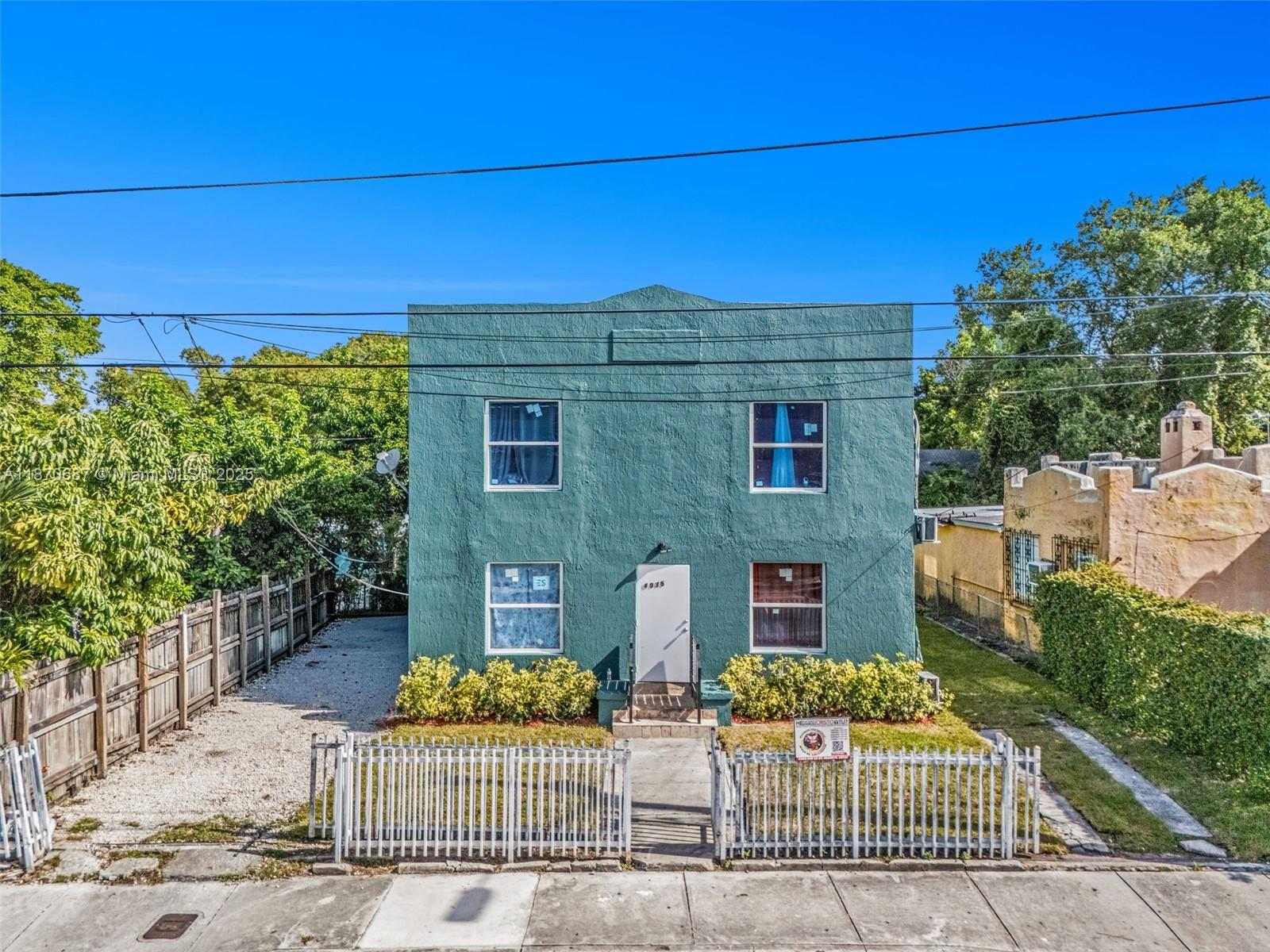 1075 Northwest 30th Street Miami, FL 33127 - Photo 2 of 12 front view of a house with a street