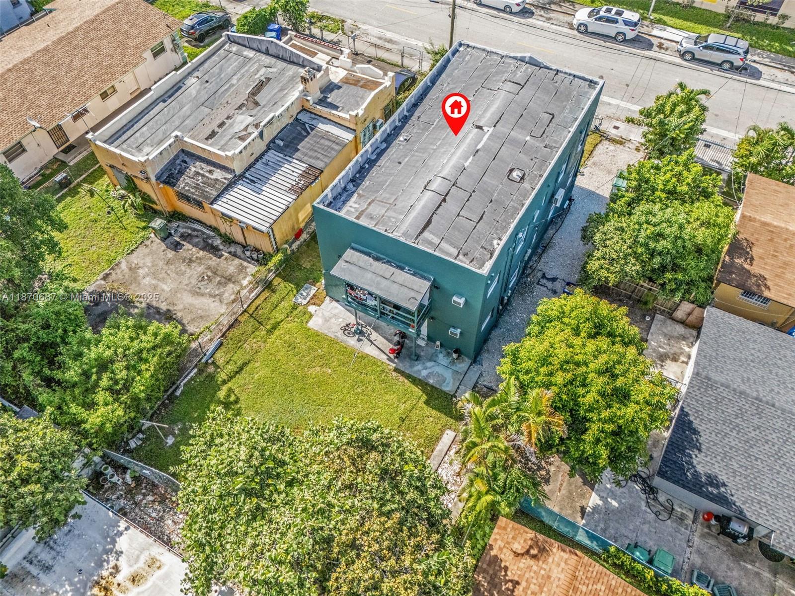 1075 Northwest 30th Street Miami, FL 33127 - Photo 4 of 12 an aerial view of a house with pool