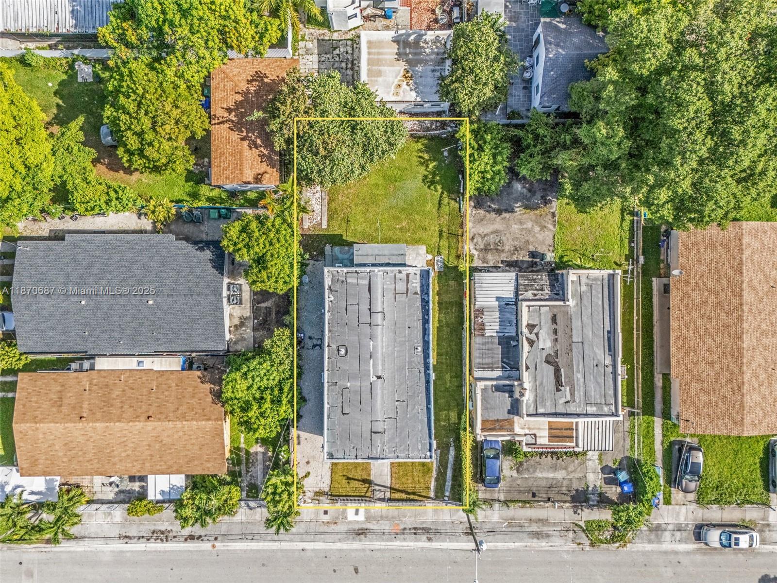 1075 Northwest 30th Street Miami, FL 33127 - Photo 5 of 12 front view of a house with a tree