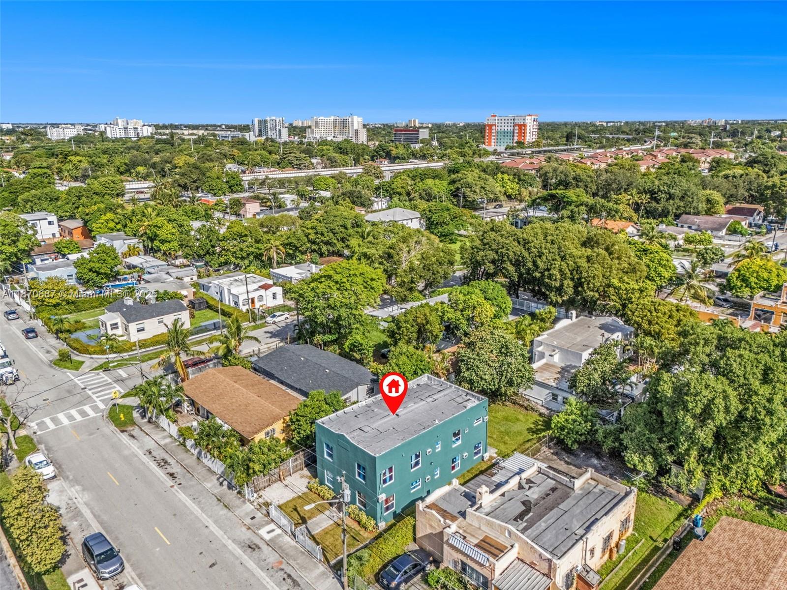 1075 Northwest 30th Street Miami, FL 33127 - Photo 6 of 12 an aerial view of multiple house