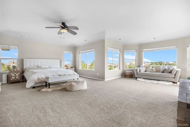 a spacious bedroom with a bed and window