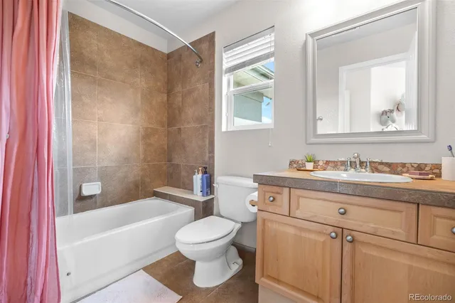 a bathroom with a sink a toilet and a bathtub