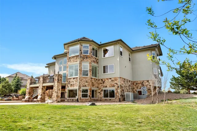 a front view of building with yard