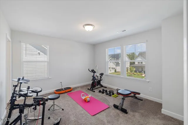 a bathroom with a shower and a sink