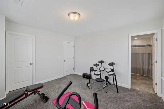 a white bath tub sitting next to a white sink