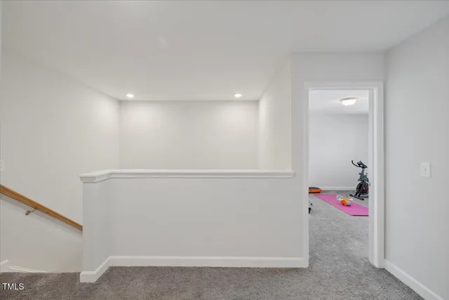 a utility room with cabinets washer and dryer