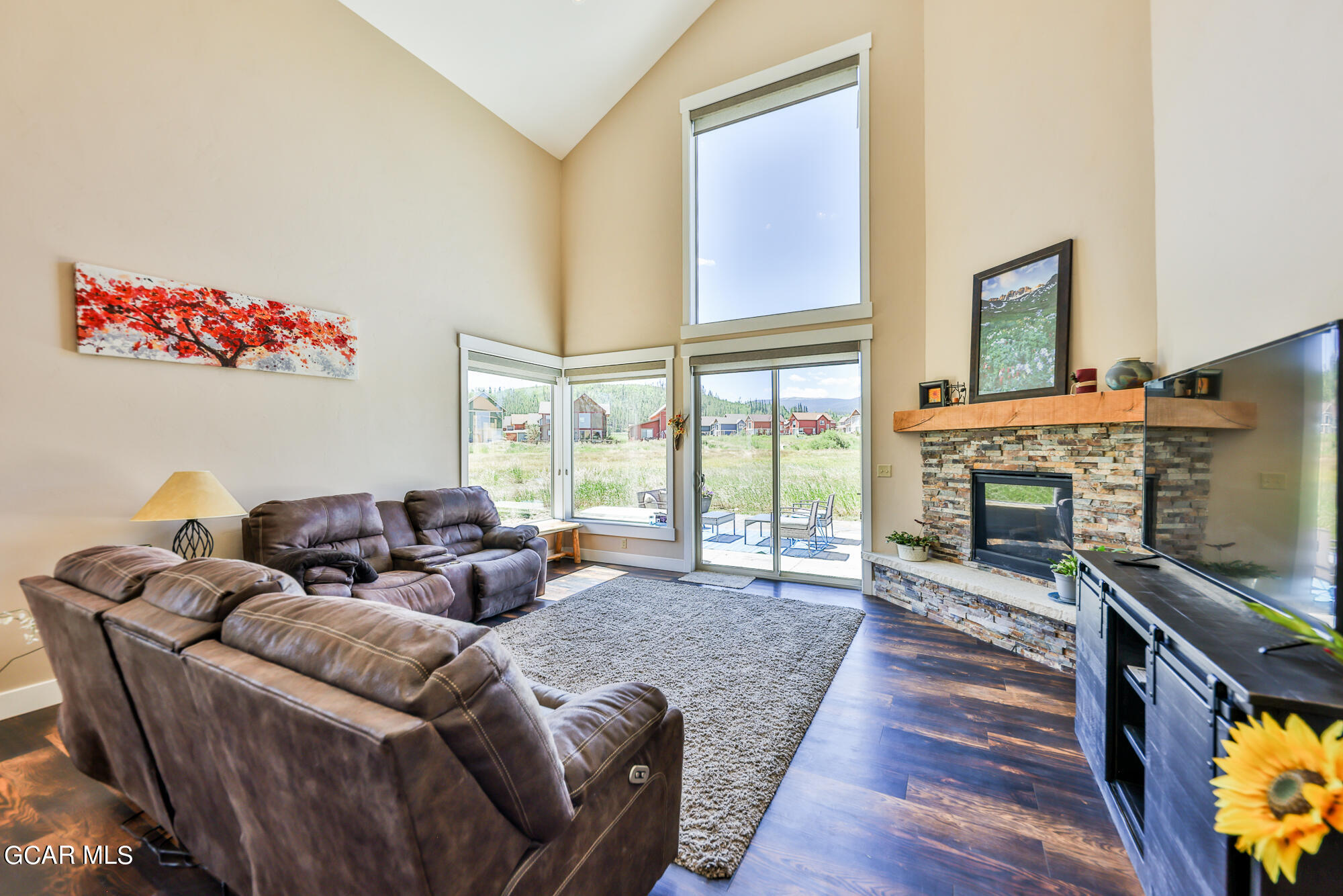 21 Brookside Trail Fraser, CO 80442 - Photo 13 of 62 a living room with furniture large window and a fireplace