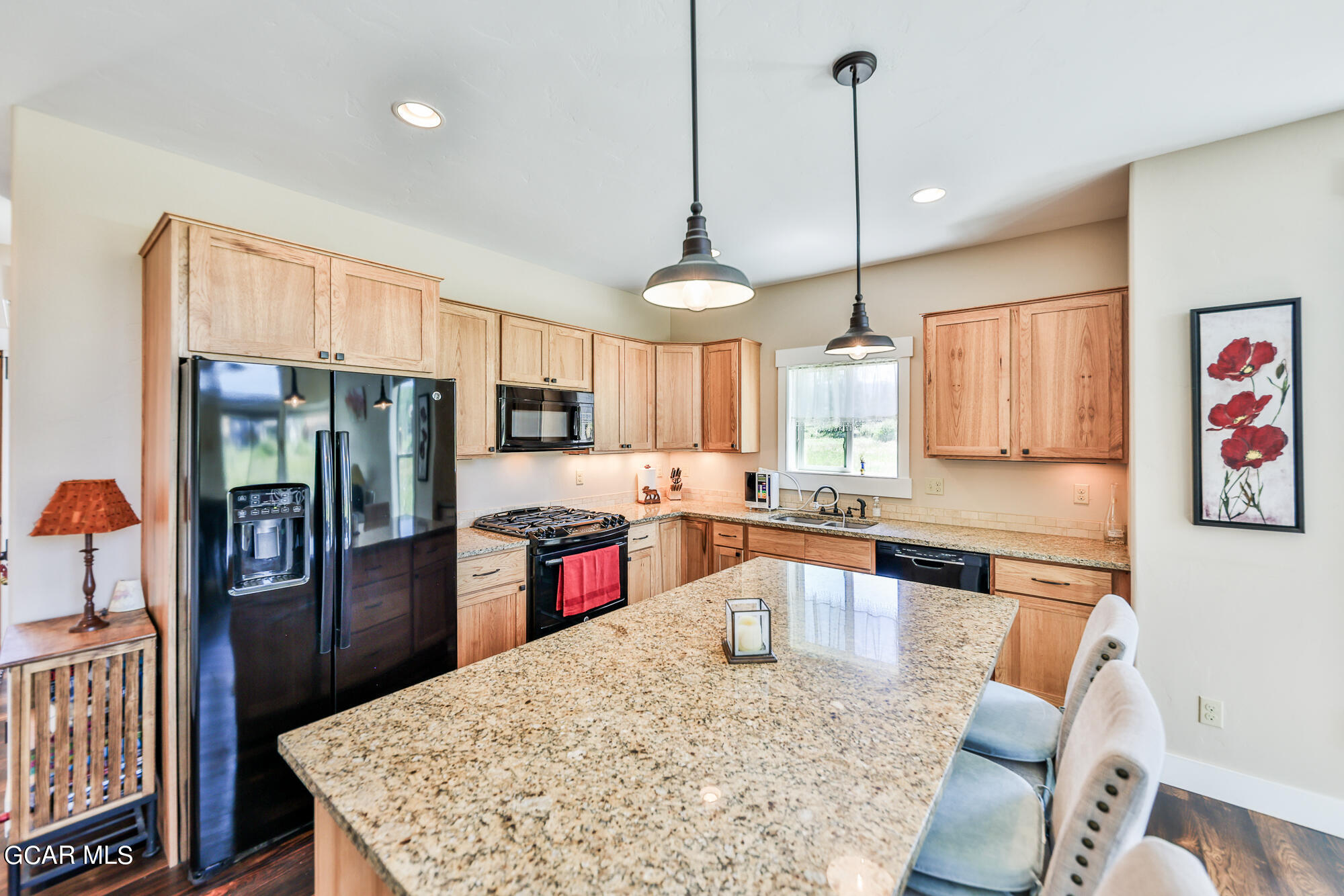 21 Brookside Trail Fraser, CO 80442 - Photo 16 of 62 a kitchen with stainless steel appliances granite countertop a sink refrigerator and cabinets