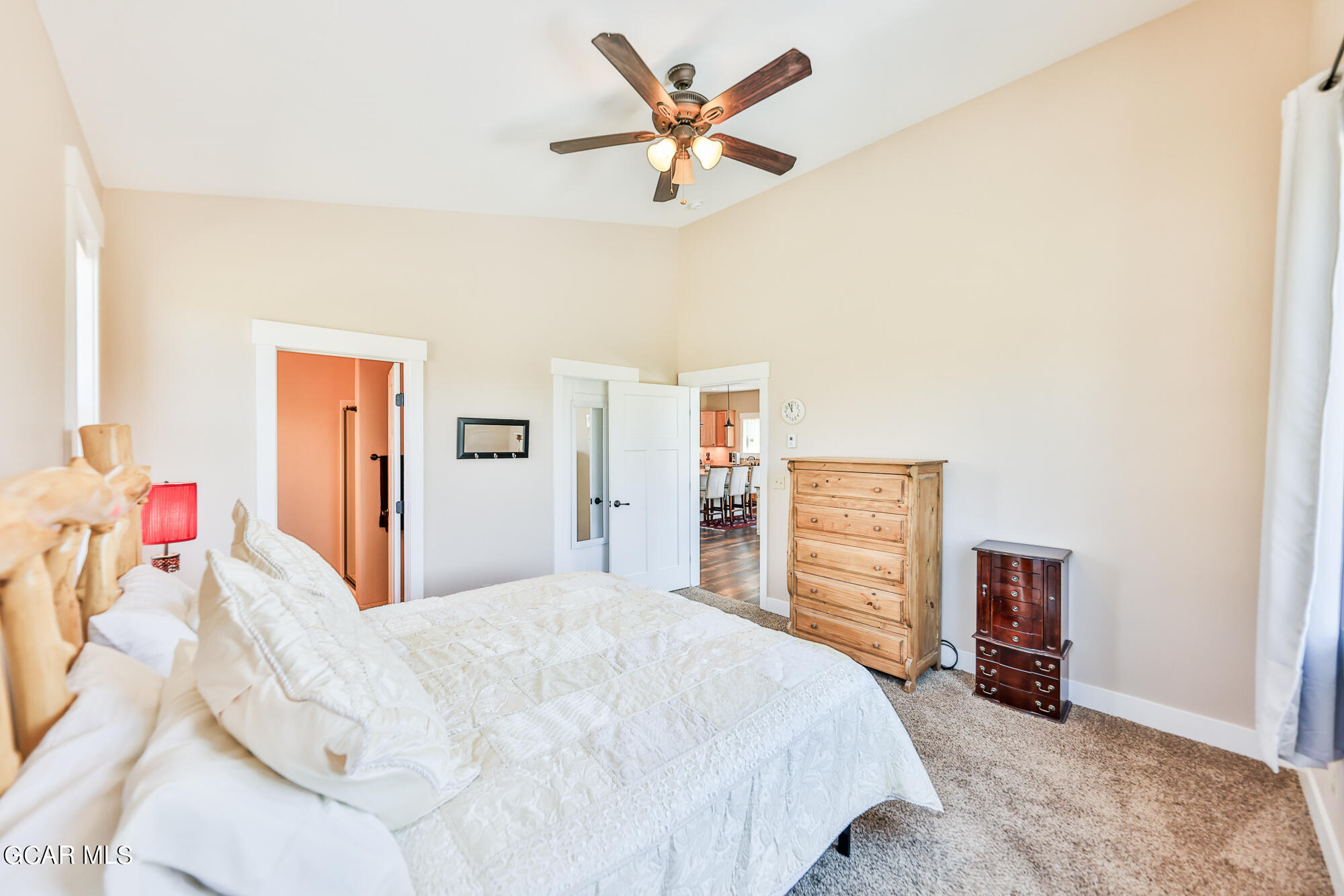 21 Brookside Trail Fraser, CO 80442 - Photo 18 of 62 a bedroom with a bed and a chandelier