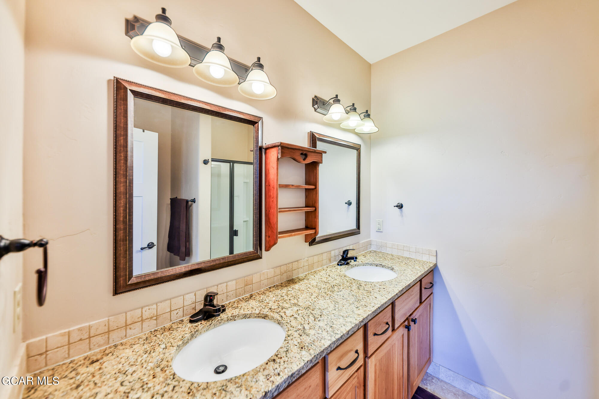 21 Brookside Trail Fraser, CO 80442 - Photo 20 of 62 a bathroom with a granite countertop sink and a mirror
