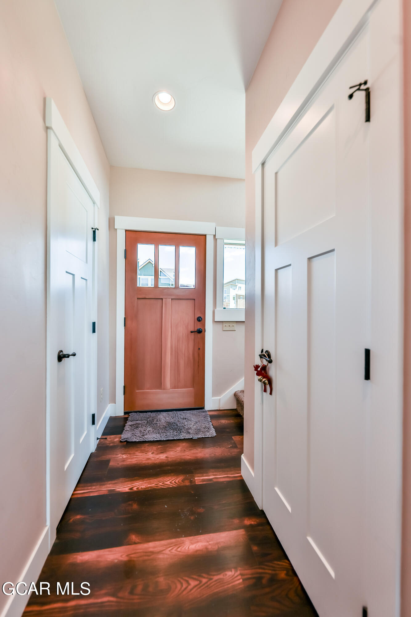 21 Brookside Trail Fraser, CO 80442 - Photo 25 of 62 a view of a hallway with wooden floor and entryway