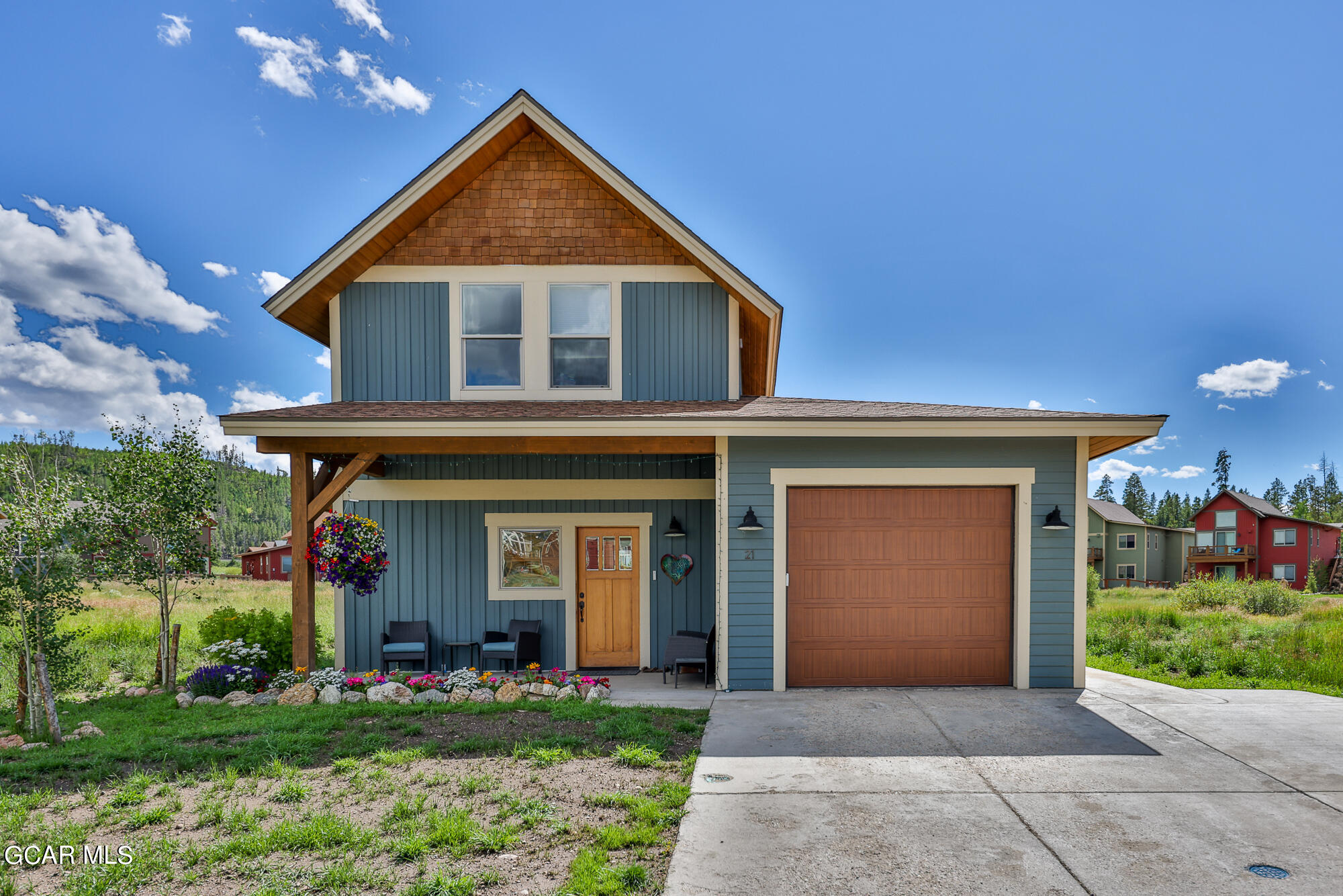 21 Brookside Trail Fraser, CO 80442 - Photo 38 of 62 a front view of a house with a yard and garage