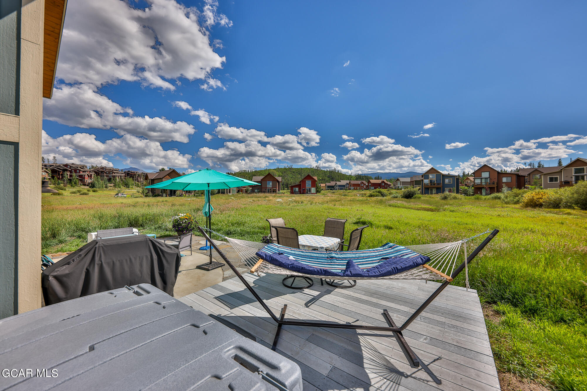 21 Brookside Trail Fraser, CO 80442 - Photo 45 of 62 a view of a patio with lawn chairs next to a yard