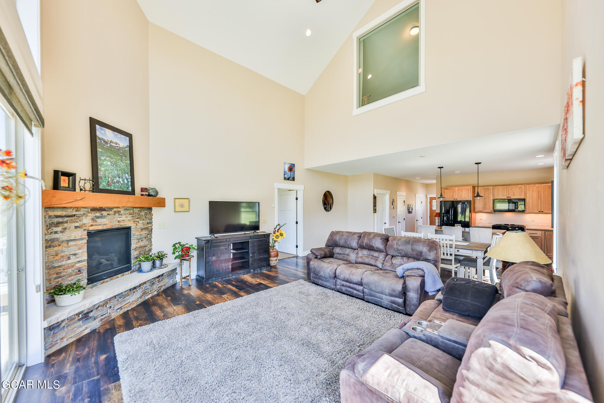 21 Brookside Trail Fraser, CO 80442 - Photo 9 of 62 a living room with furniture and a fireplace