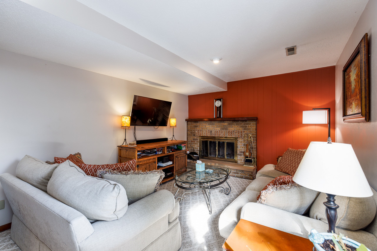301 Joanne Lane Rochelle, IL 61068 - Photo 4 of 31 a living room with furniture a fireplace and a flat screen tv