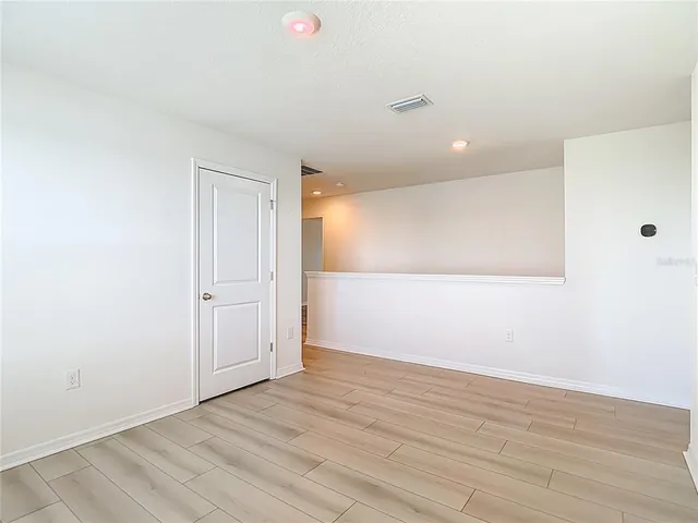 a view of a storage & utility room with a window