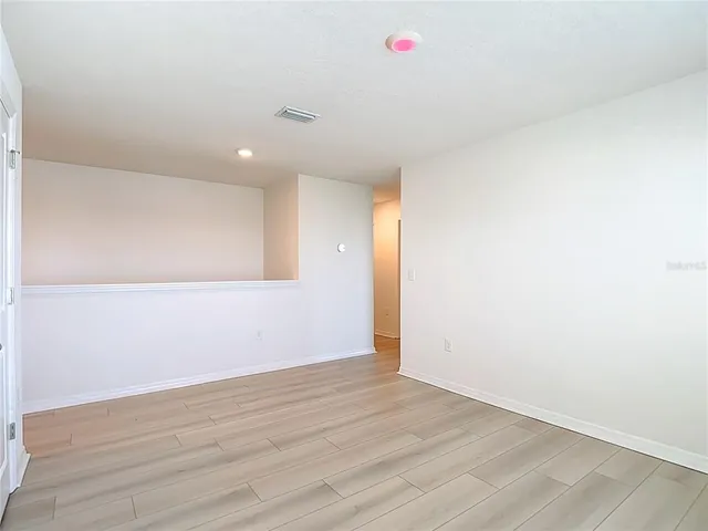 a view of an ocean with a floor to ceiling window