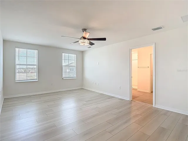 a view of a lake with houses in the back