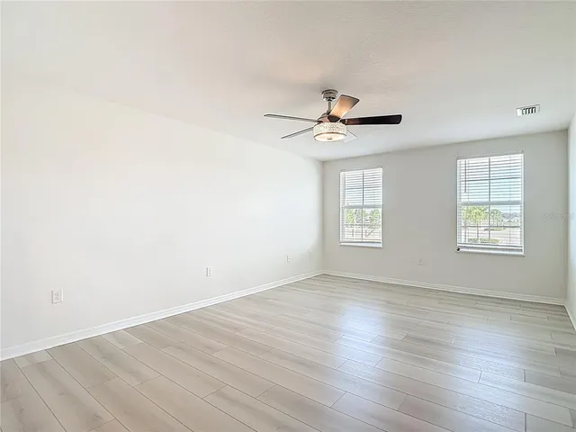 an aerial view of a house with a garden and trees