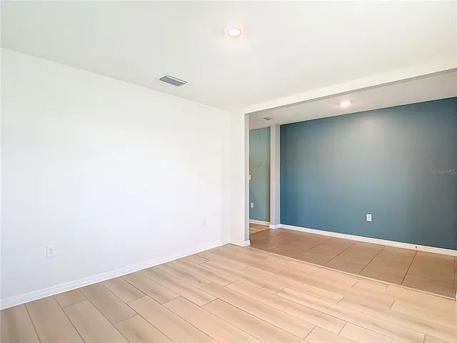 a kitchen with granite countertop cabinets stainless steel appliances and a counter space