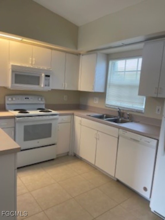 4523 22nd Street Southwest Lehigh Acres, FL 33973 - Photo 9 of 10 a kitchen with a stove sink and cabinets