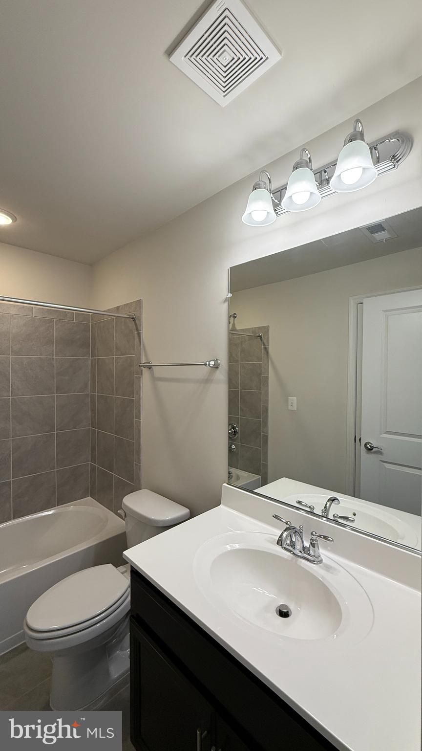 1949 Greenbriar Hall Road Dumfries, VA 22026 - Photo 22 of 26 a bathroom with a sink toilet and shower