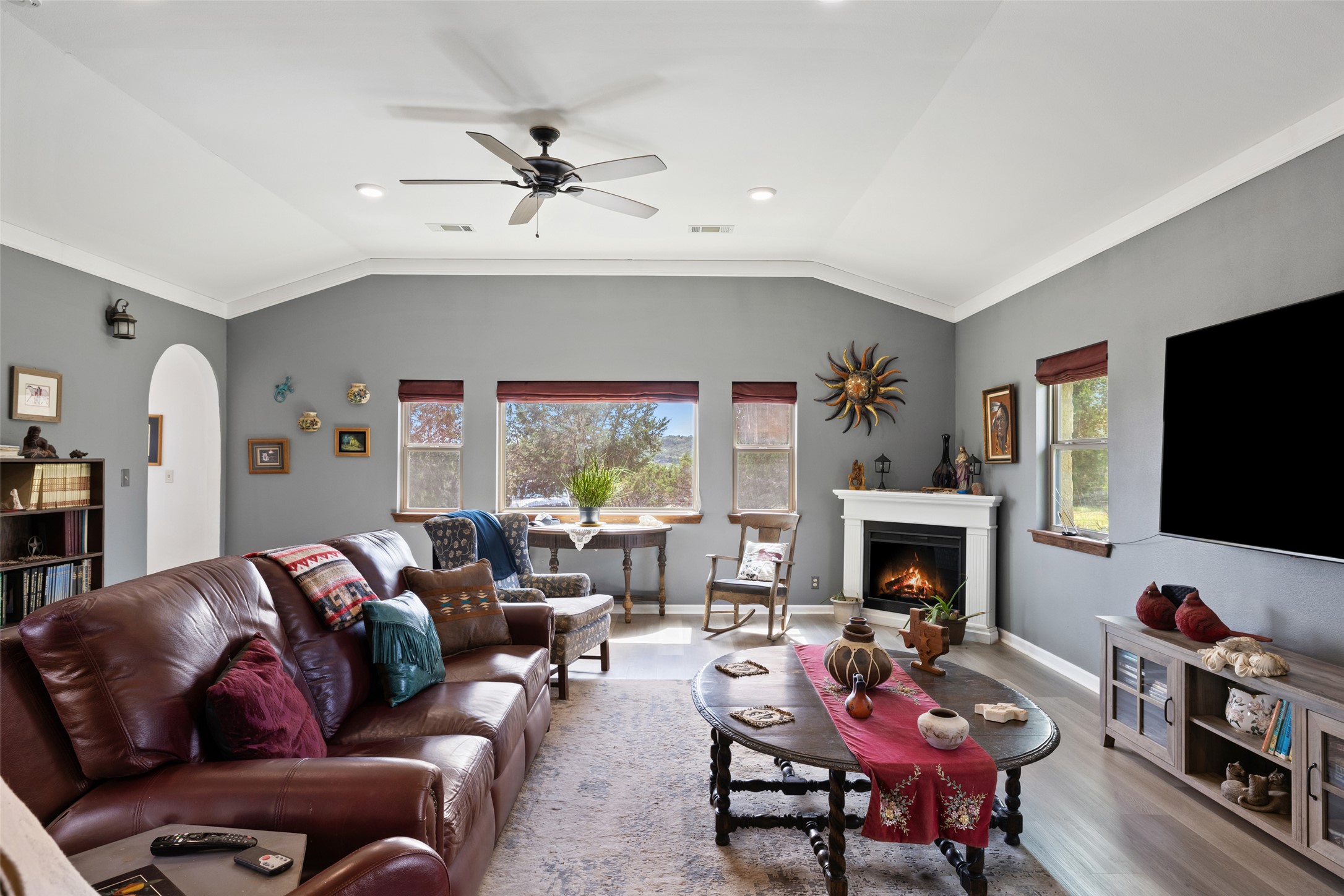 2966 Rm 165 Dripping Springs Dripping Springs, TX 78620 - Photo 5 of 23 Spacious living area featuring a vaulted ceiling with a ceiling fan, recessed lighting, and light wood-finish flooring