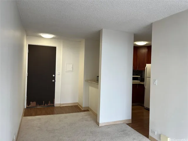 an empty room with closet and bathroom