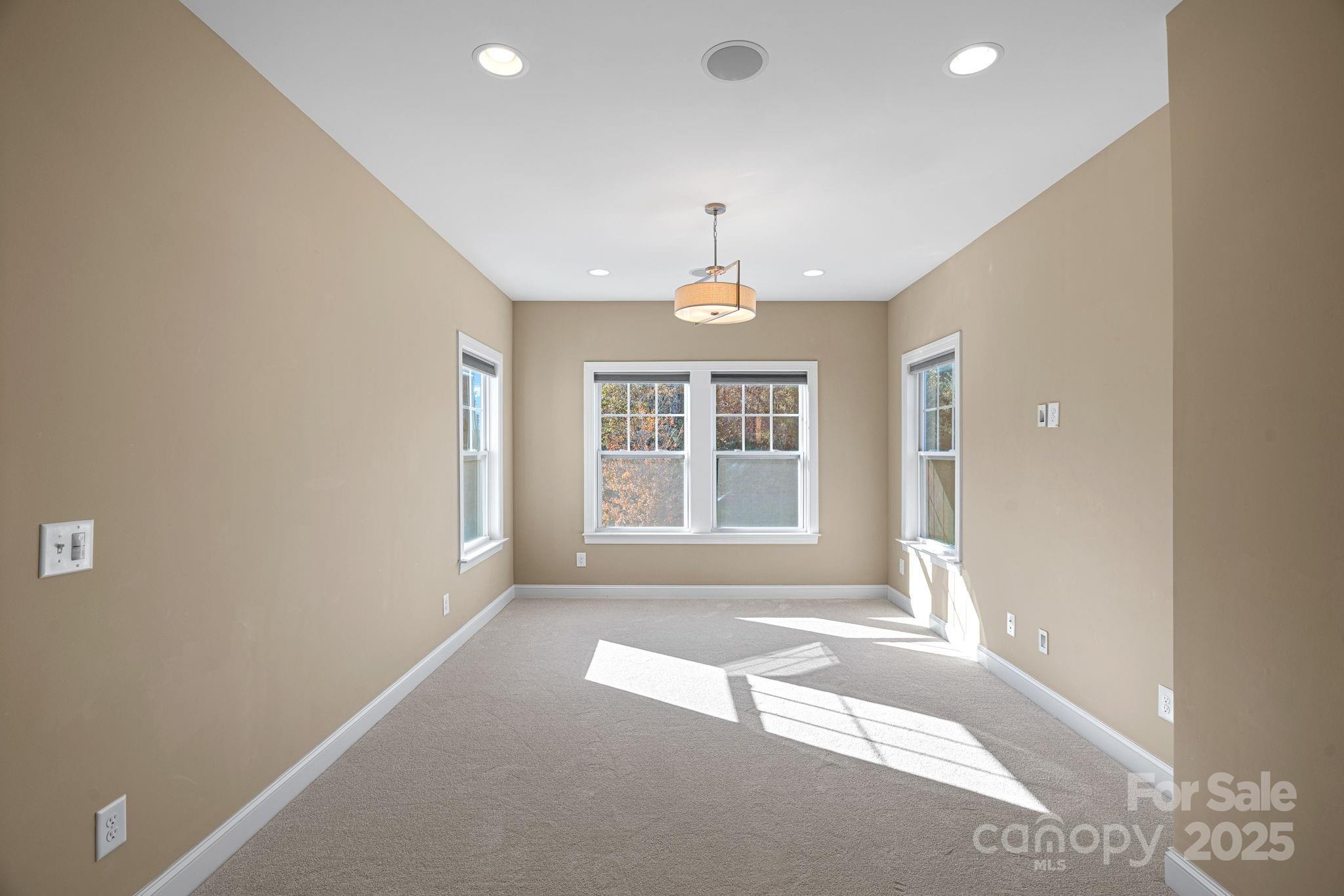 16909 Setter Point Lane Davidson, NC 28036 - Photo 16 of 45 a view of an empty room with a window