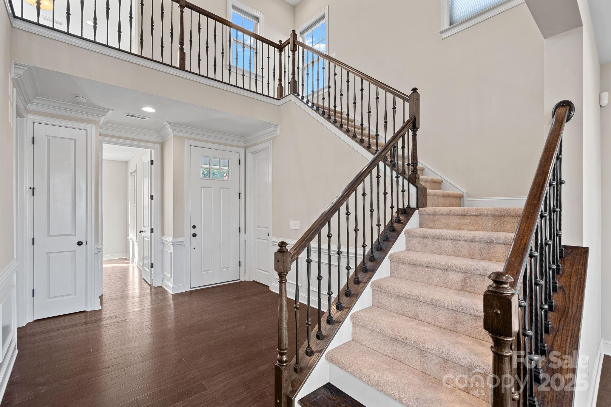 16909 Setter Point Lane Davidson, NC 28036 - Photo 2 of 45 a view of staircase with railing and white walls