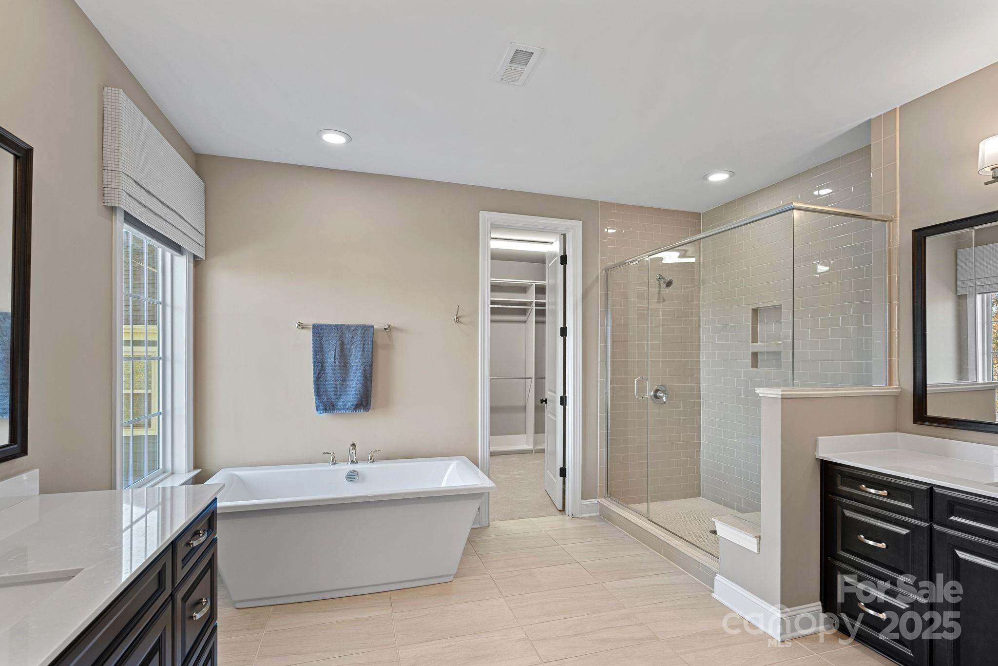 16909 Setter Point Lane Davidson, NC 28036 - Photo 22 of 45 a bathroom with a bathtub shower sink and toilet