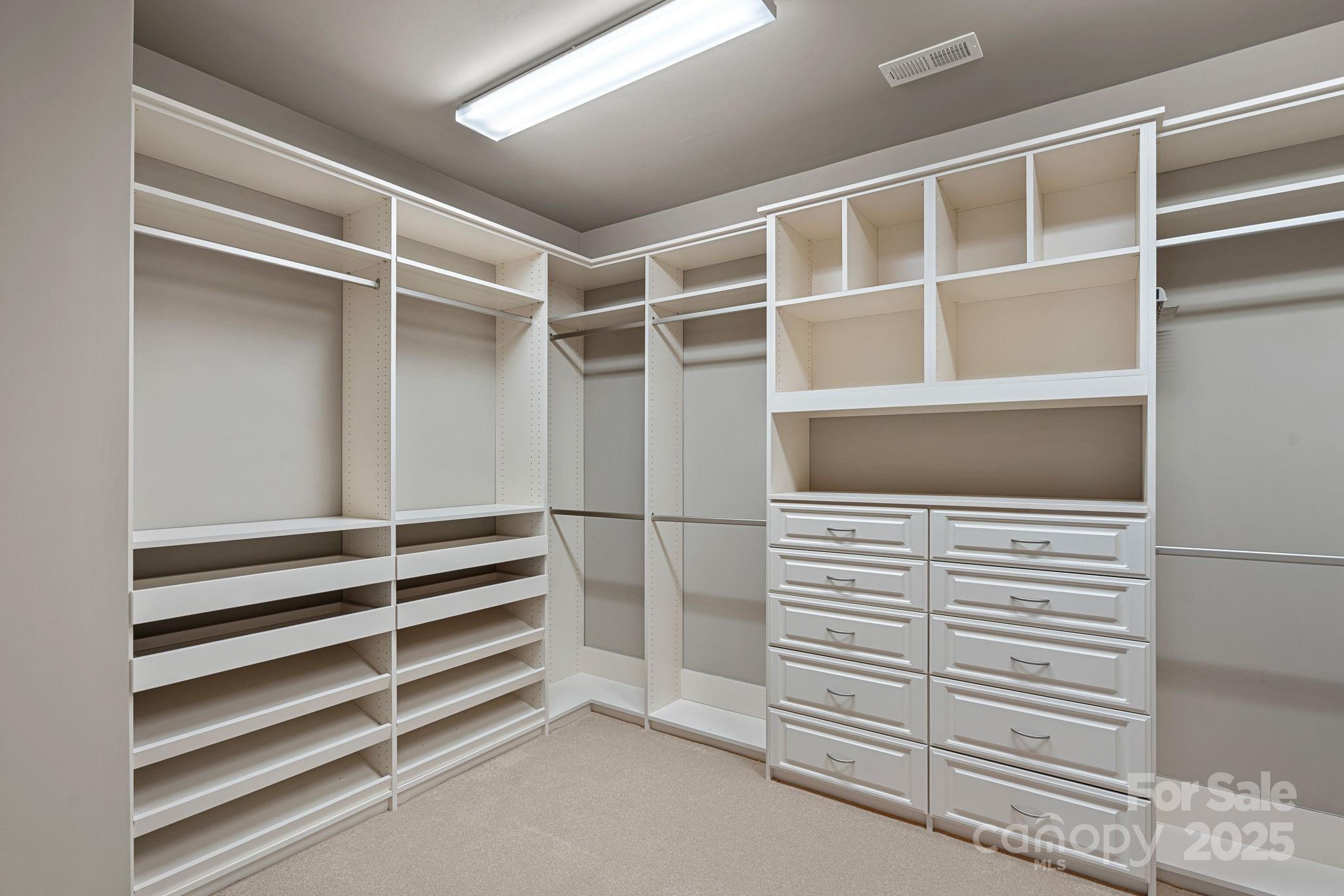 16909 Setter Point Lane Davidson, NC 28036 - Photo 23 of 45 a view of an empty walk in closet