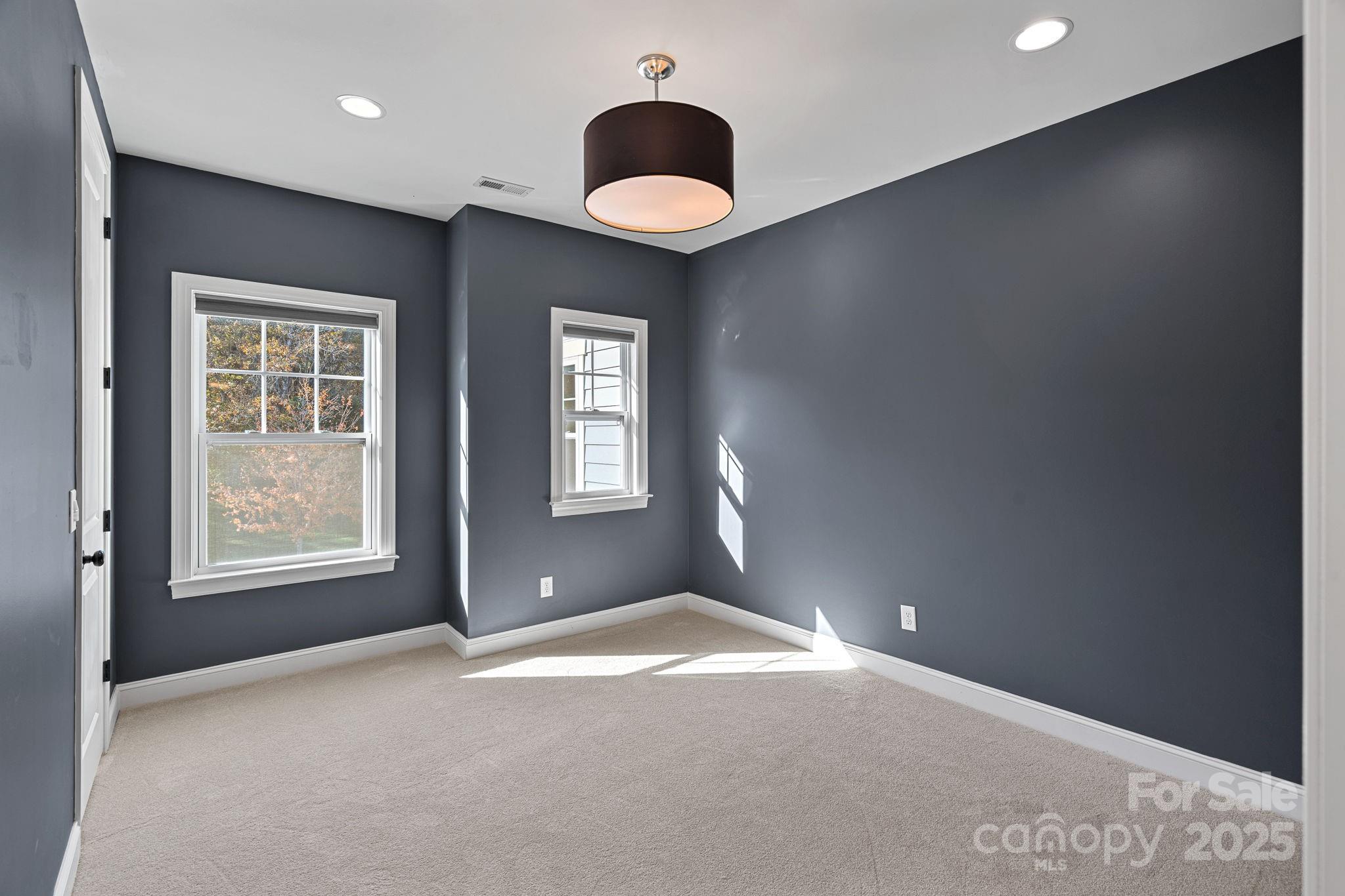 16909 Setter Point Lane Davidson, NC 28036 - Photo 28 of 45 an empty room with windows and closet