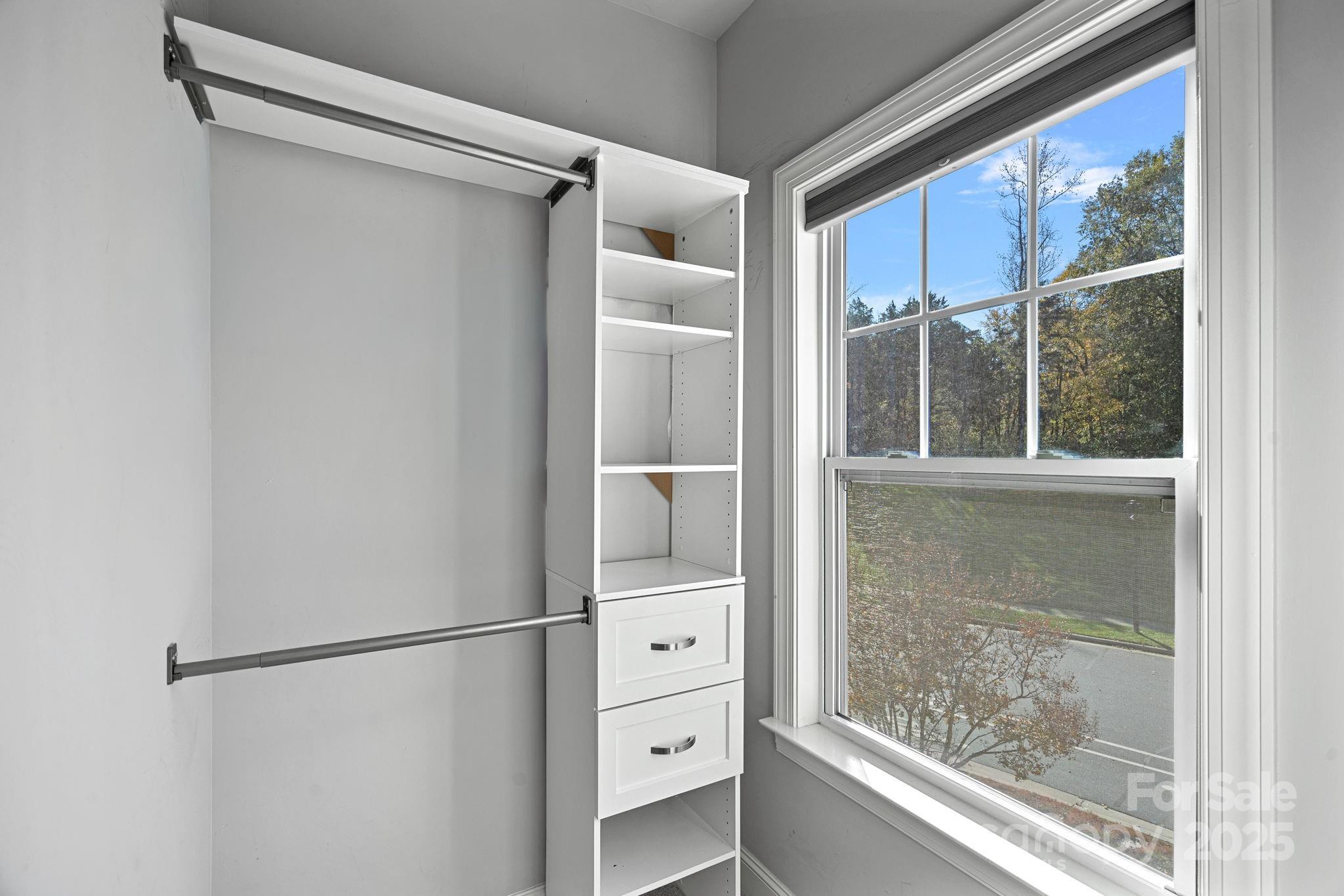 16909 Setter Point Lane Davidson, NC 28036 - Photo 30 of 45 a bathroom with a shower and a window