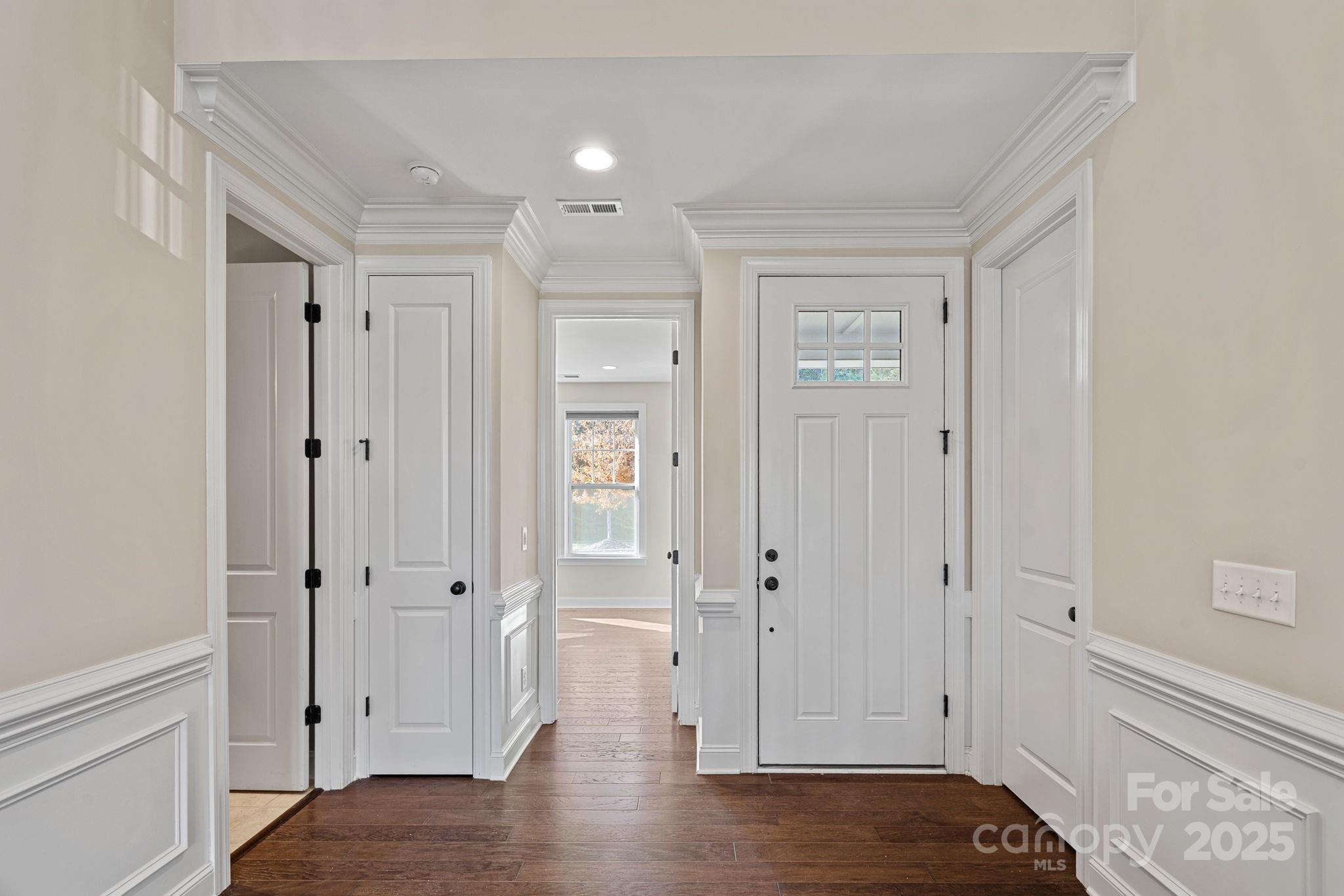 16909 Setter Point Lane Davidson, NC 28036 - Photo 3 of 45 a view of a hallway with wooden floor