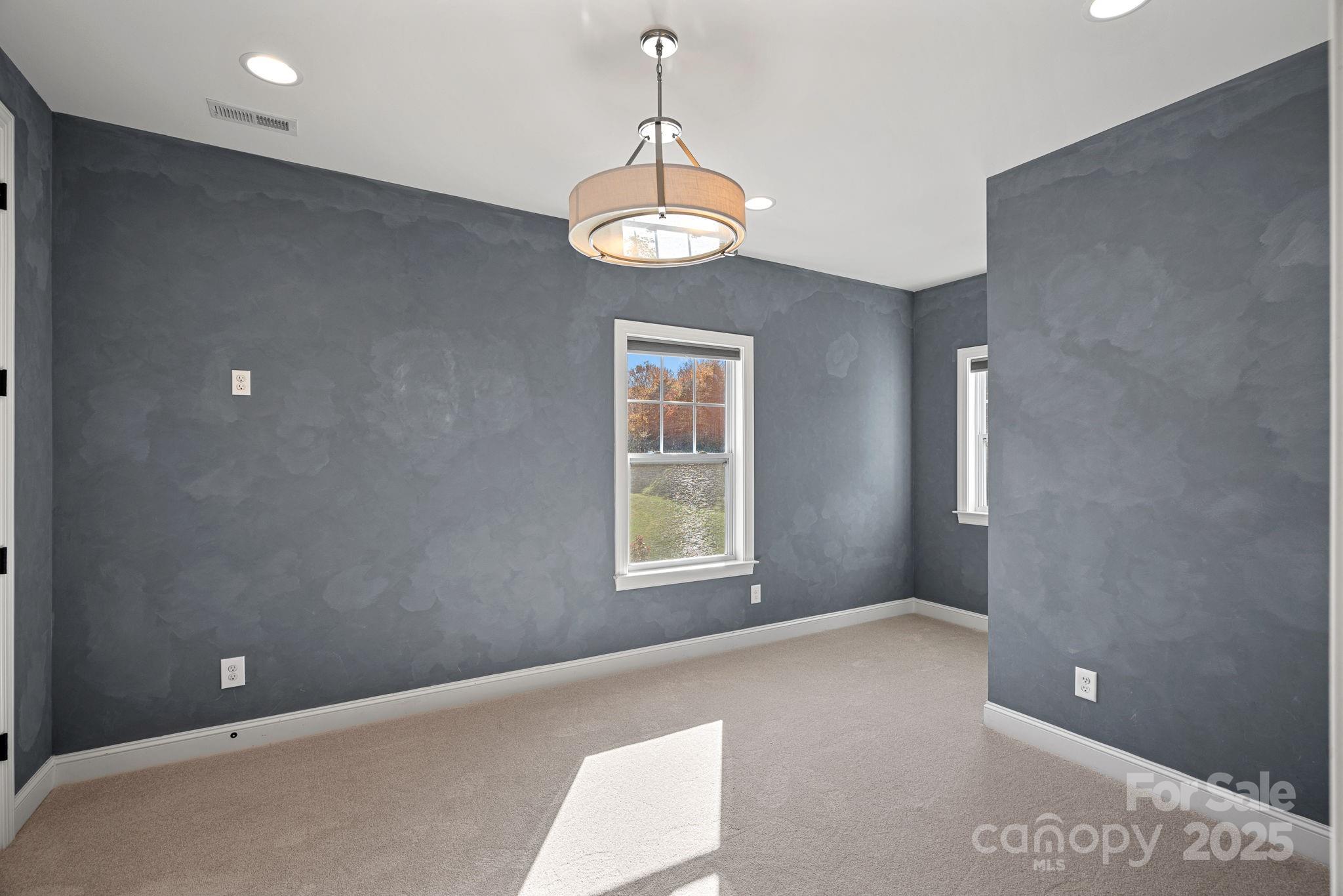 16909 Setter Point Lane Davidson, NC 28036 - Photo 31 of 45 a view of an empty room with a window