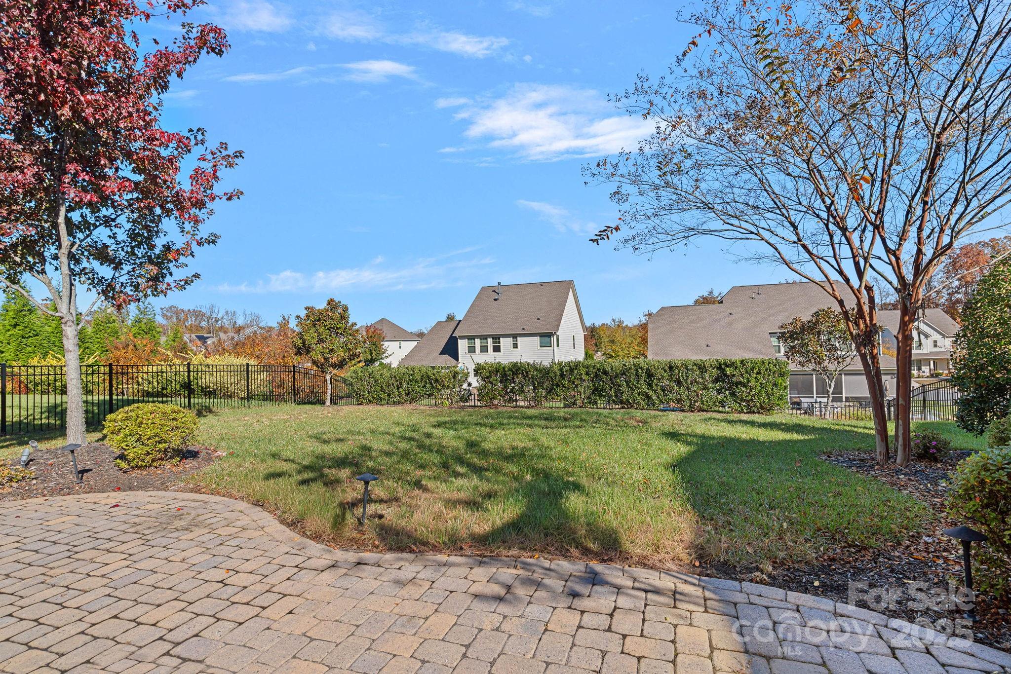 16909 Setter Point Lane Davidson, NC 28036 - Photo 37 of 45 a view of a garden with a building in the background