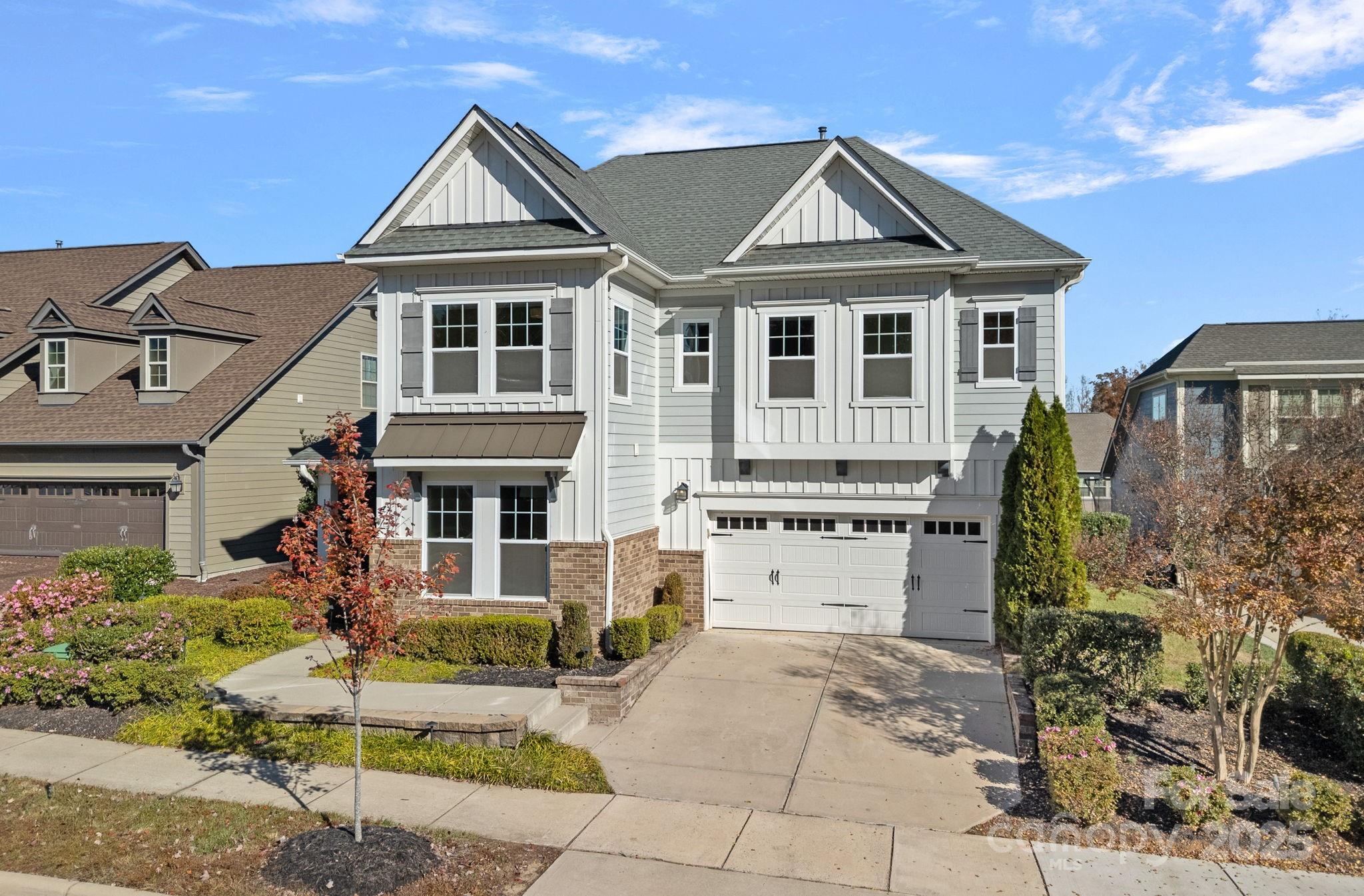 16909 Setter Point Lane Davidson, NC 28036 - Photo 38 of 45 a front view of a house with a garden