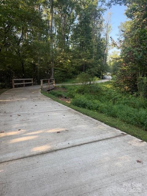 16909 Setter Point Lane Davidson, NC 28036 - Photo 45 of 45 a backyard of a house with lots of green space